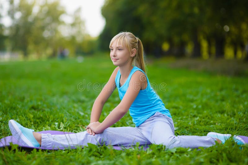 Girl Doing Gymnastic Exercises or Exercising Outdoor Stock Photo ...