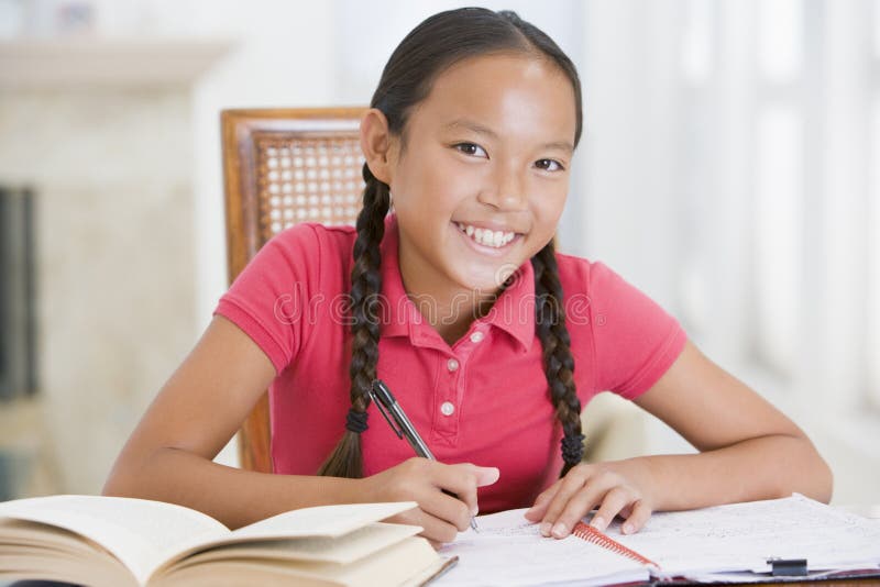 Girl Doing Her Homework royalty free stock photography