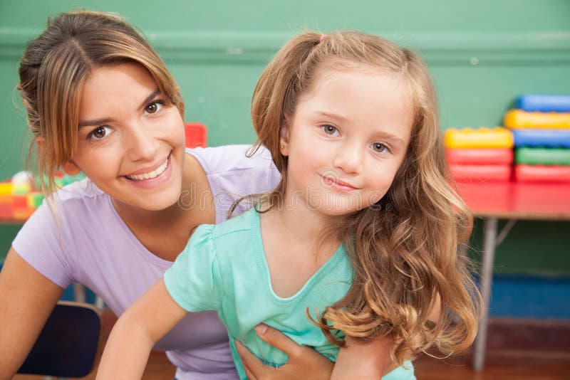Girl Drawing with Her Teacher Stock Photo Image of pupil, children