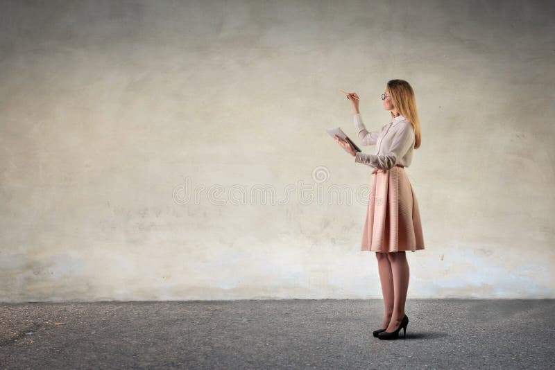 Girl drawing on a neutral background royalty free stock photo Girl drawing on a neutral background royalty free stock photo