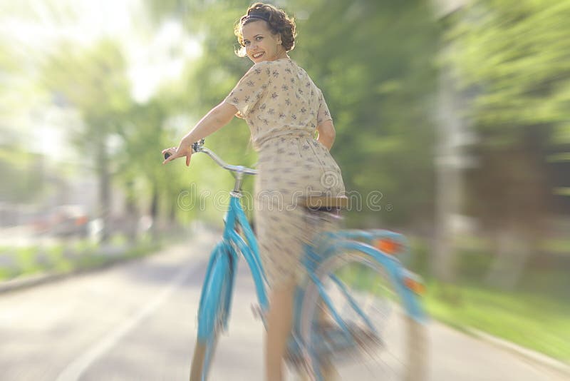 Girl in dress on bicycle stock photo. Image of elegant 63504808
