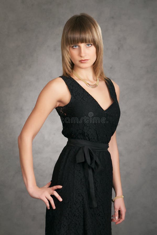 Girl in a dress on a grey background