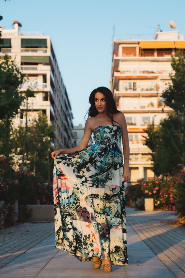 Girl In A Dress Posing In Motion On A Street Background Stock Photo ...