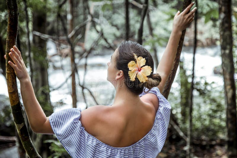 Girl in a dress in the rain forest stock photo Girl in a dress in the rain forest stock photo