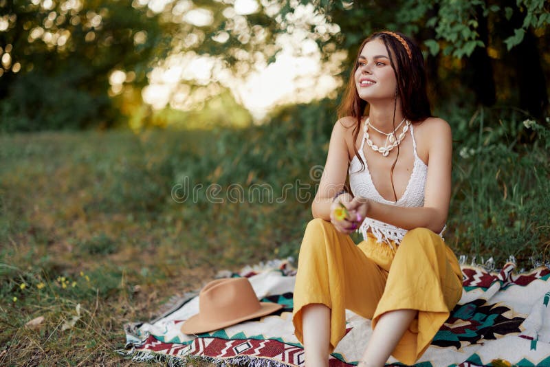 Girl Dressed As a Hippie Eco Relaxing in the Park, Sitting on a Blanket ...