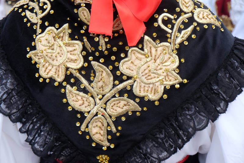 Girl dressed in folk costumes go to the church at the Mass on Thanksgiving day in Stitar, Croatia