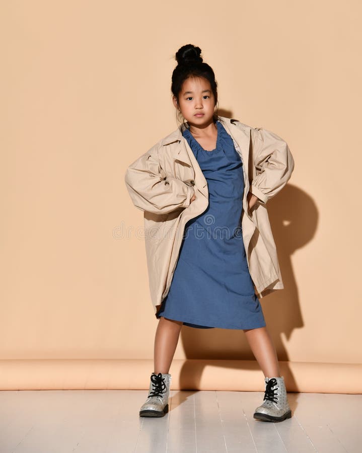 Girl dressed raises her thumbs up showing what she likes as she looks in this outfit