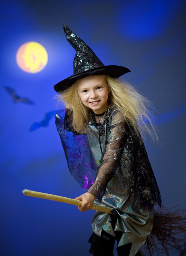 Girl dressed up as witch in night flying broom stock photography Girl dressed up as witch in night flying broom stock photography