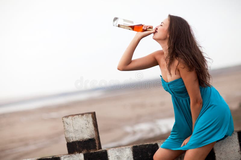 Girl drinking alcohol stock photo. Image of legs, fashion 10549012