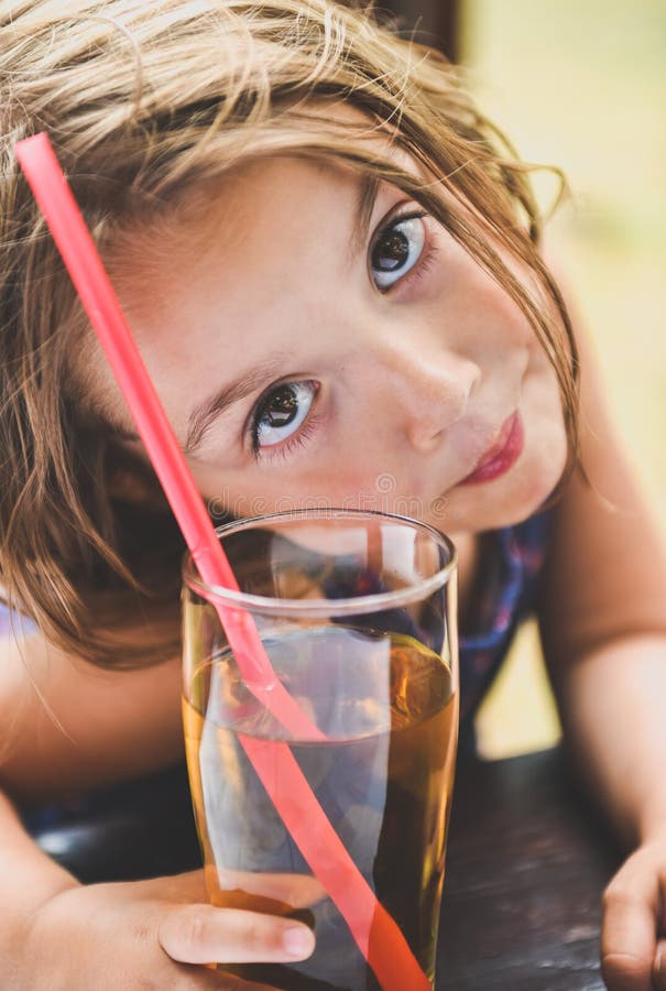 Girl Drinking Apple Juice with a Straw Stock Image Image of lifestyle