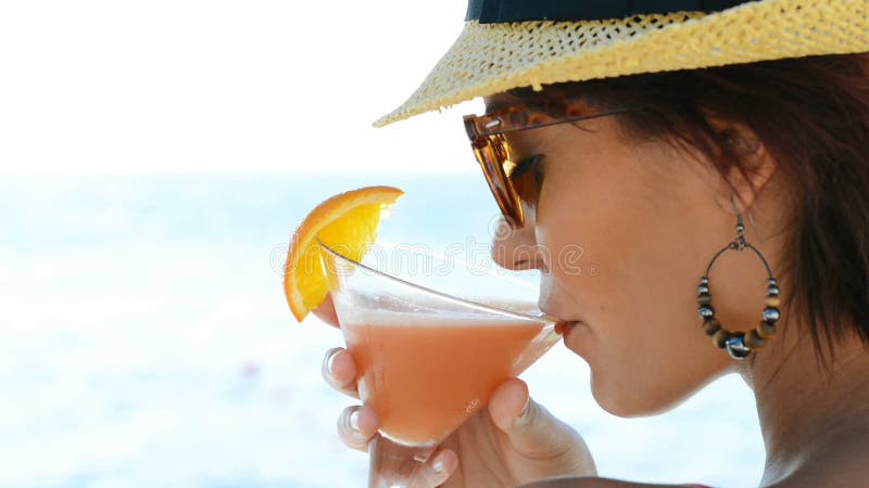 Girl Drinking Cocktail At Sea