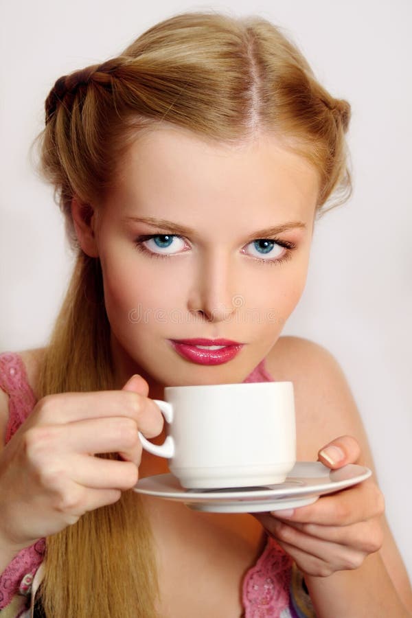 Girl drinking coffee or tea