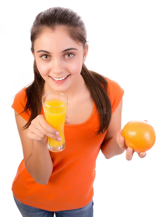 Girl drinking orange juice stock photo. Image of female 28133604