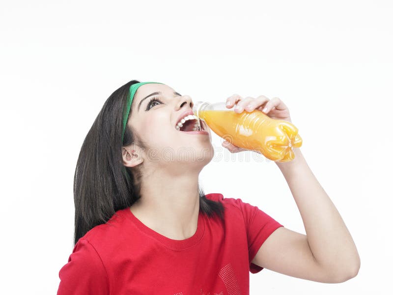 Girl drinking orange juice