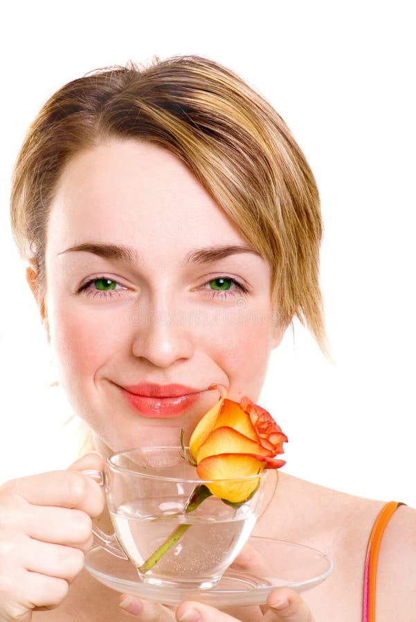 Girl drinking a refreshing drink with rose