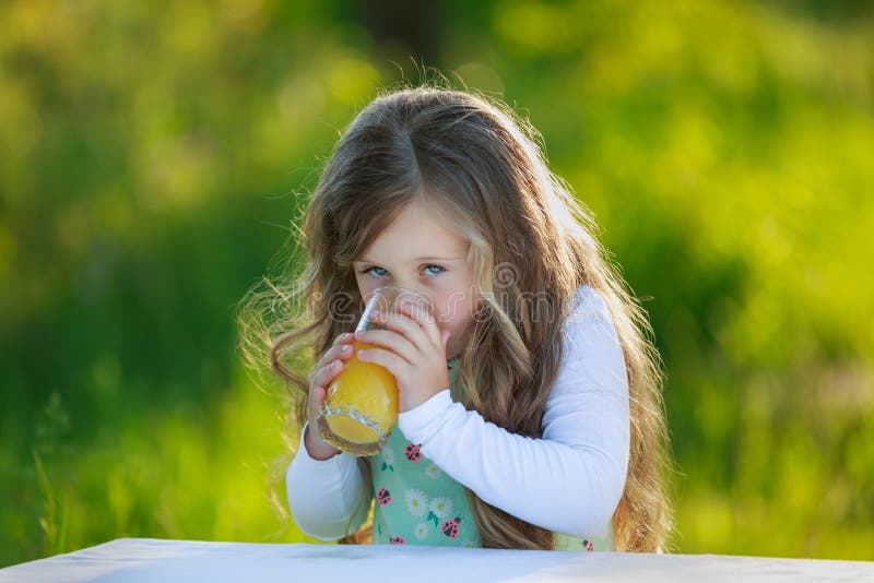 Girl drinks juice stock image. Image of meadow, nature 74301965