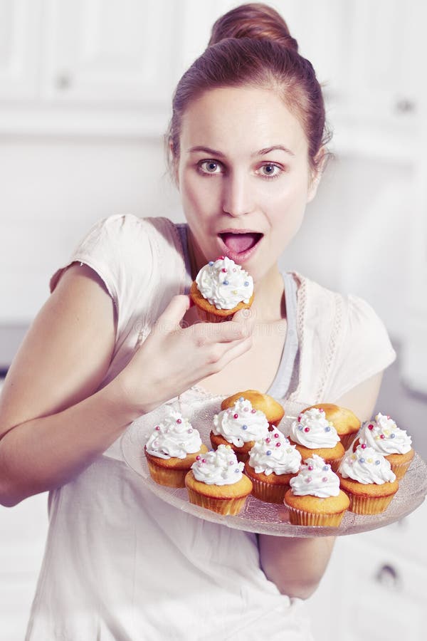 Girl Eat Muffins stock image. Image of baking, kitchen 29645315