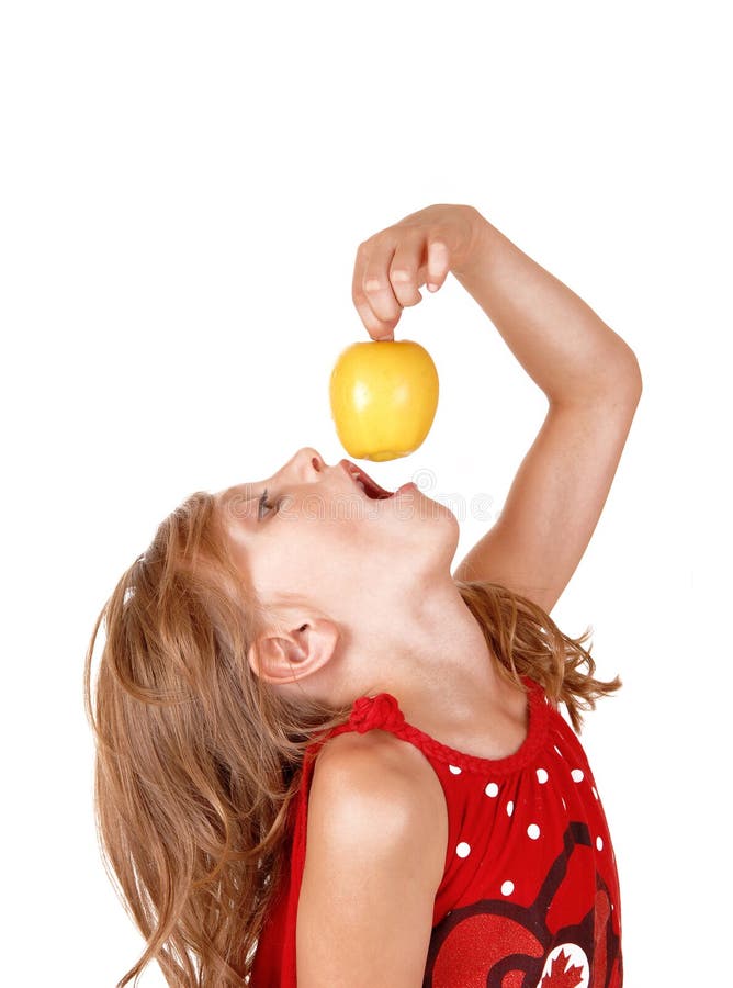 Girl eating an apple.