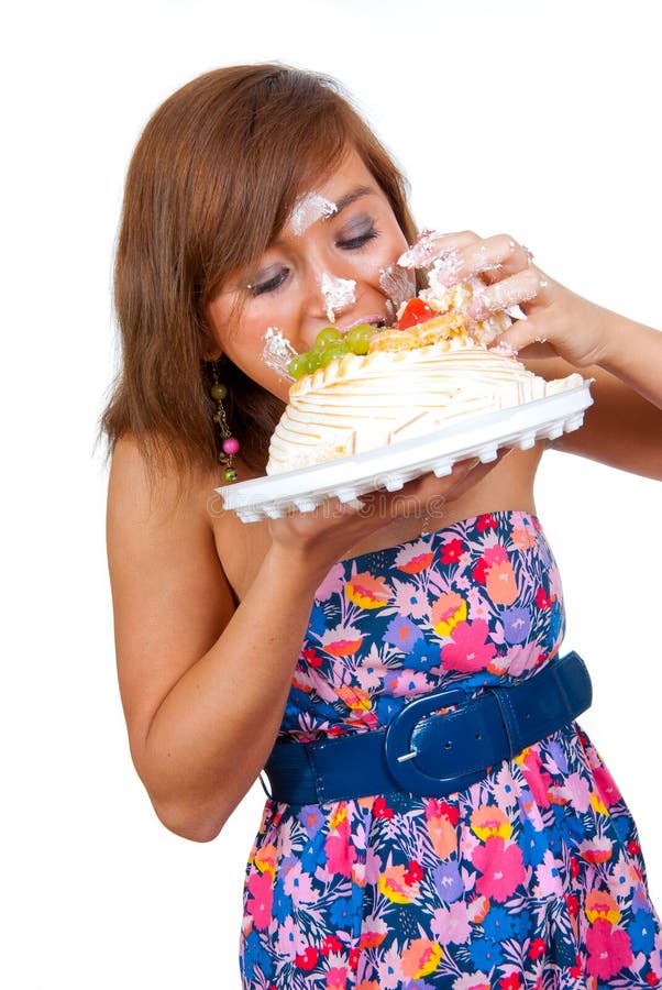 Girl eating cake with his hands