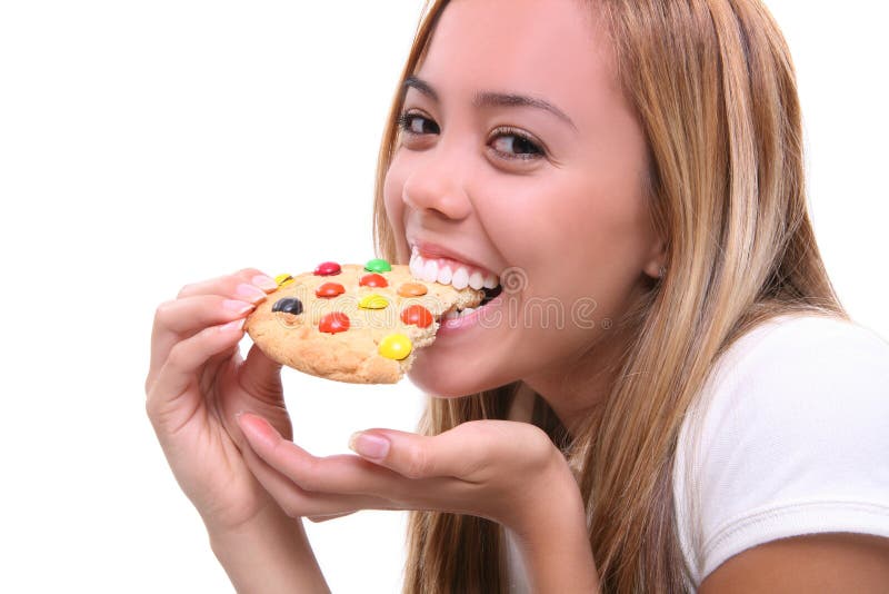 Girl Eating Cookie stock image. Image of hungry, emotion 3286191