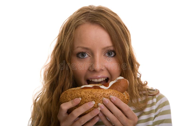 Girl eating hot dog stock photo. Image of dinner, white 12488660
