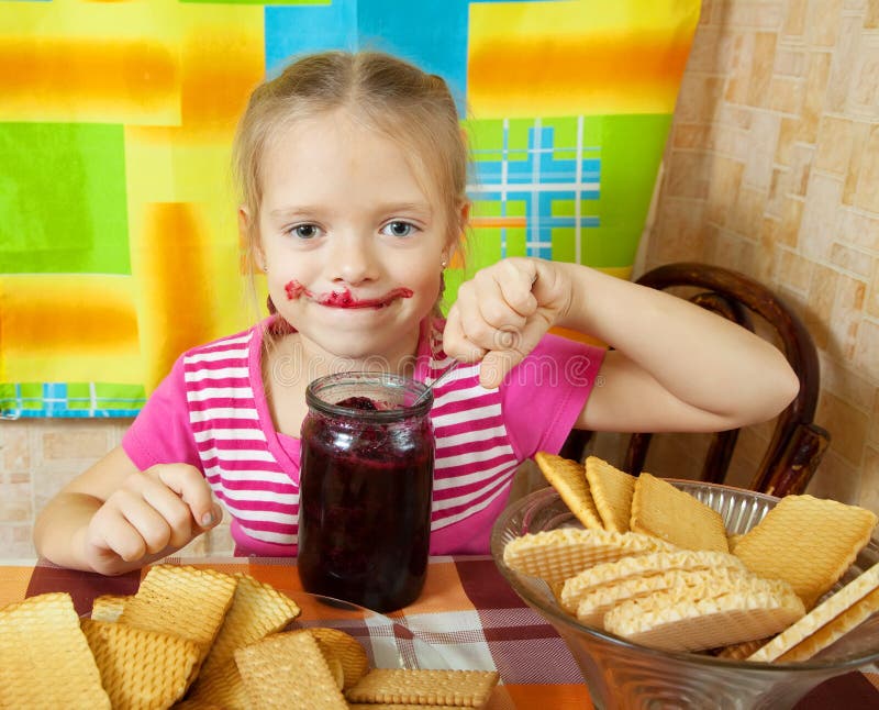 Girl eating jam from jar stock image. Image of happy 21310003