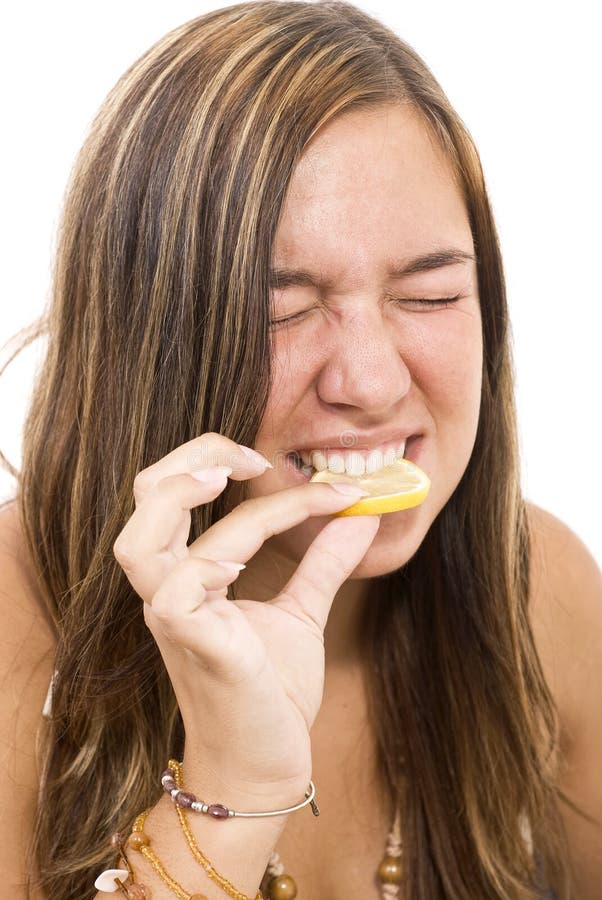 Girl eating lemon