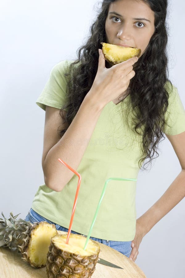 Girl Eating Pineapple Picture. Image 2660738