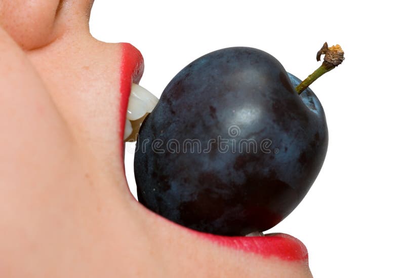 Girl eating a plum closeup