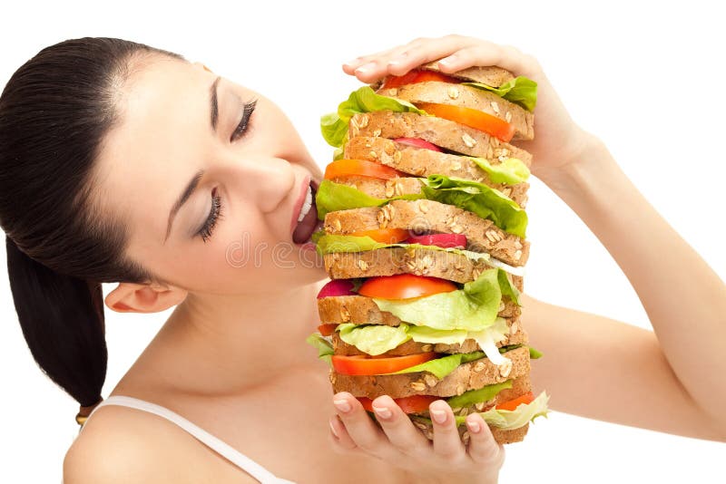 Girl eating sandwich, big bite stock image Girl eating sandwich, big bite stock image