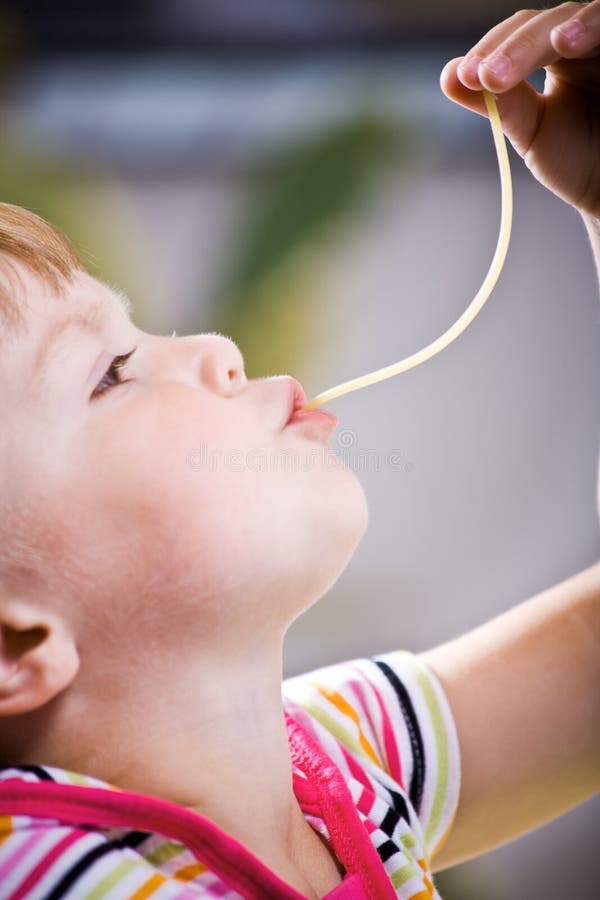 Girl eating spaghetti