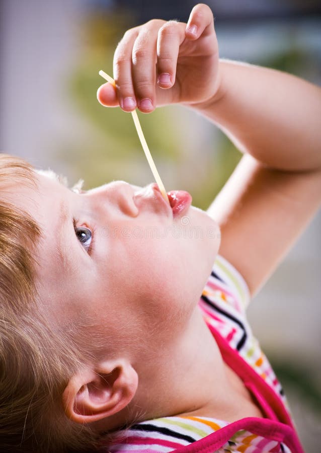 Girl eating spaghetti