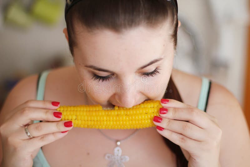 Girl eating Sweetcorn