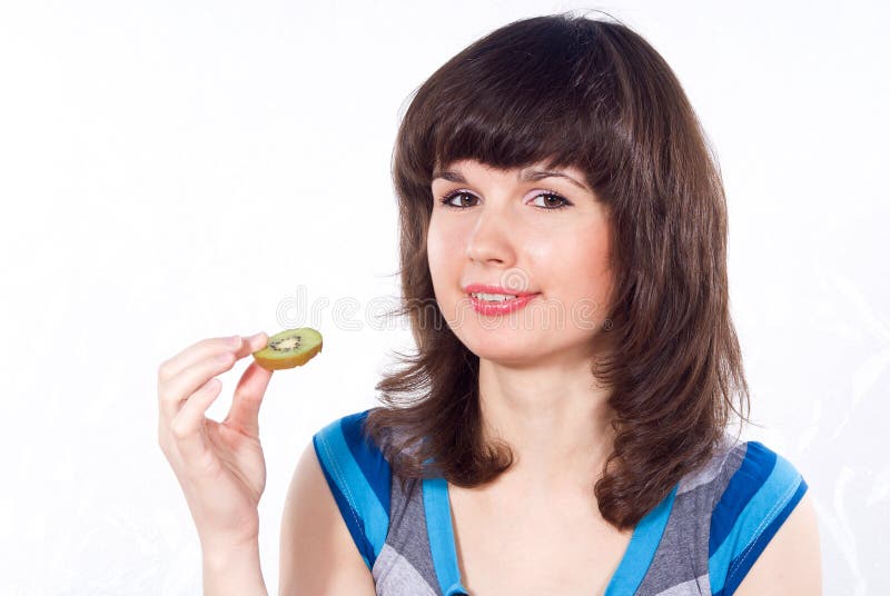 Girl eats kiwi stock image. Image of kiwi, health, fruit 24541443
