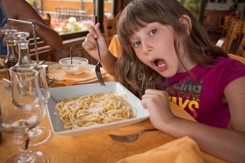 Girl Eats Pasta in Italian Restaurant Stock Photo Image of dinner