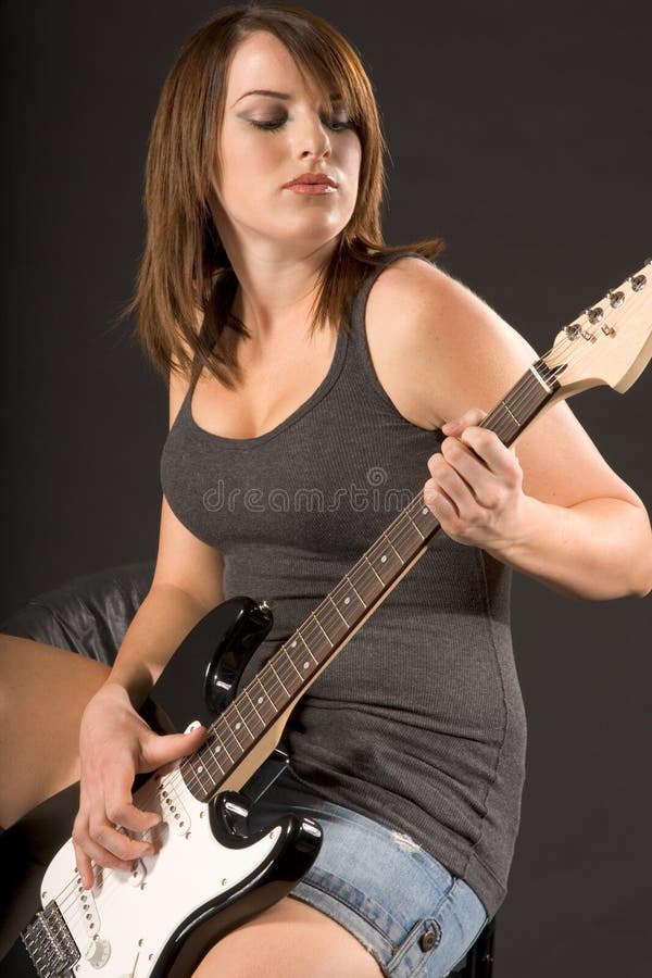 Girl playing electric bass stock photo. Image of guitarist 13901430