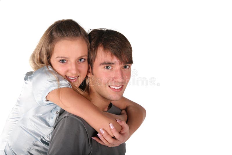 Girl embraces boy from back