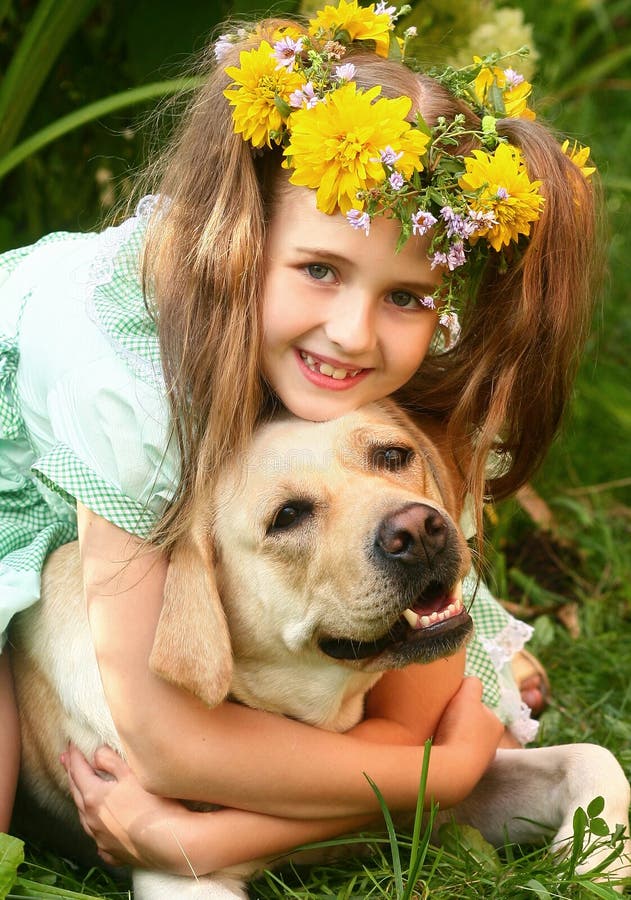 Girl embracing a dog.