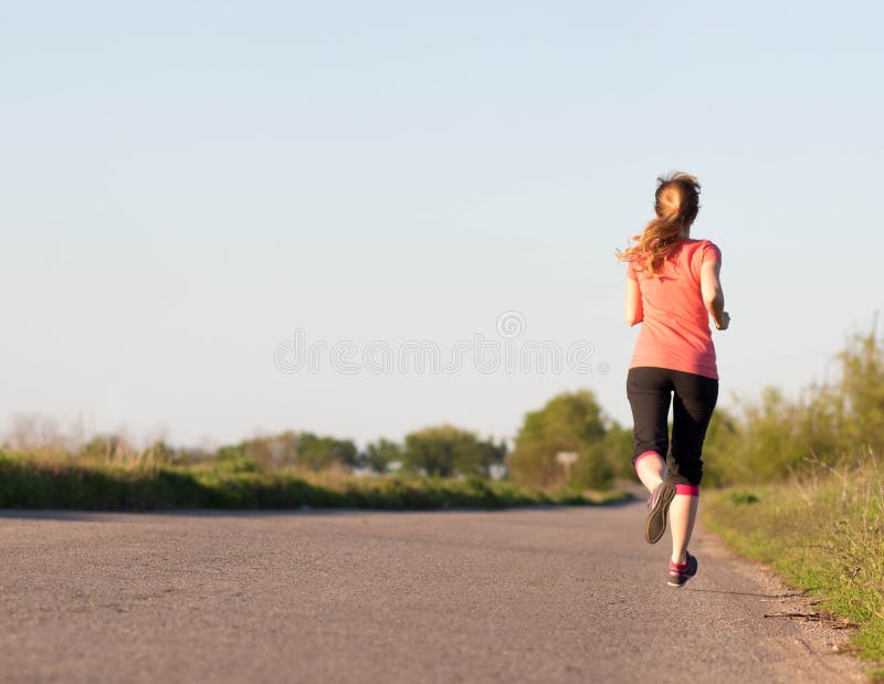 Girl is engaged in jogging stock photo. Image of young 57854162