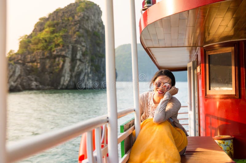 Girl enjoying last sunshine on a cruise boat stock photo Girl enjoying last sunshine on a cruise boat stock photo