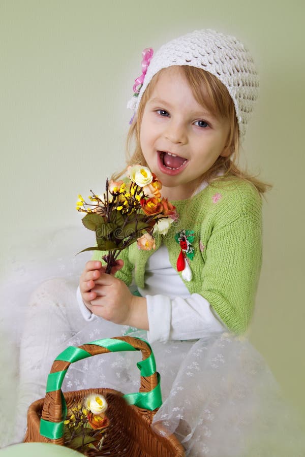 Girl enjoying spring flower blossom