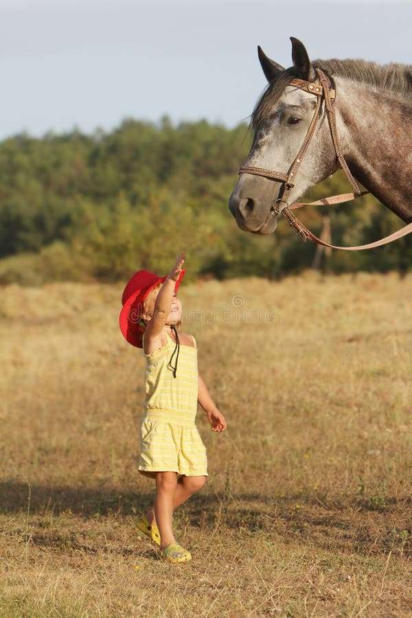 Horse and Little Girl Cuddle with the Woman, Summer Background with ...