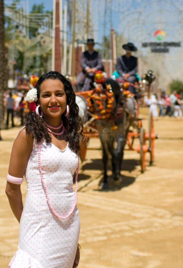 Girl in Feria Dress with Horse and Carriage