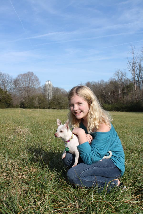 Girl In A Field With Her Dog