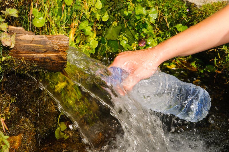 Girl is Filling the Water Bottle Stock Image - Image of stone, maurici ...