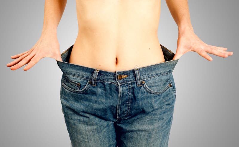 Girl with flat belly enjoying her succeeded diet royalty free stock photos