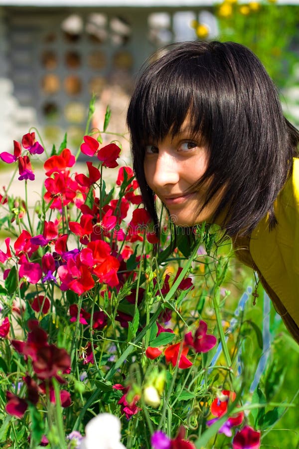 Girl with flowers stock photo. Image of beauty 14386116