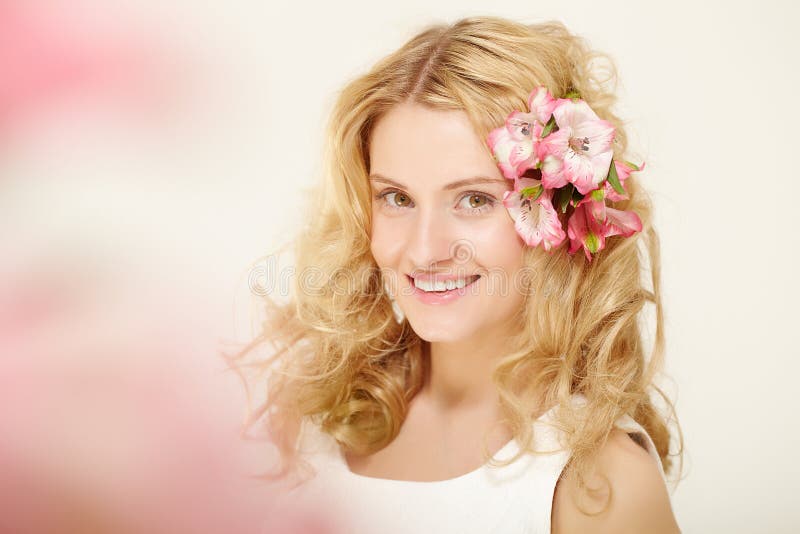 Girl with flowers in hair stock photo. Image of emotion 26817068
