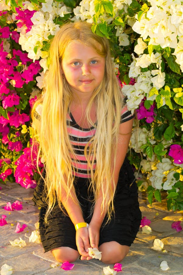 Girl in flowers stock image. Image of enjoy, green, flowers 38763585