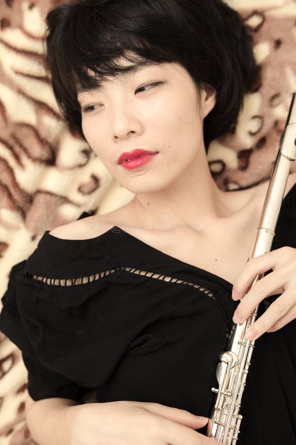 Girl and flute stock photo. Image of portraits, self 53722140